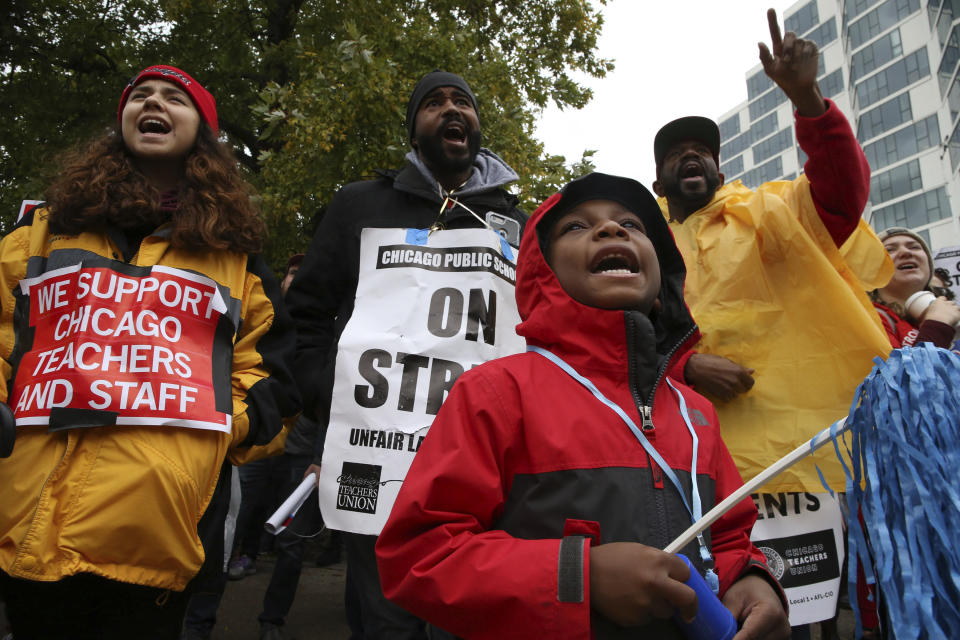 CPS student. Bryce Kelley, 7, listens to speakers following a march by Chicago Teachers Union members and supporters through the streets of Chicago's Hyde Park neighborhood during the "Nurse in Every School" Solidarity March for Justice, on Monday, Oct. 21, 2019. (Antonio Perez/Chicago Tribune via AP)