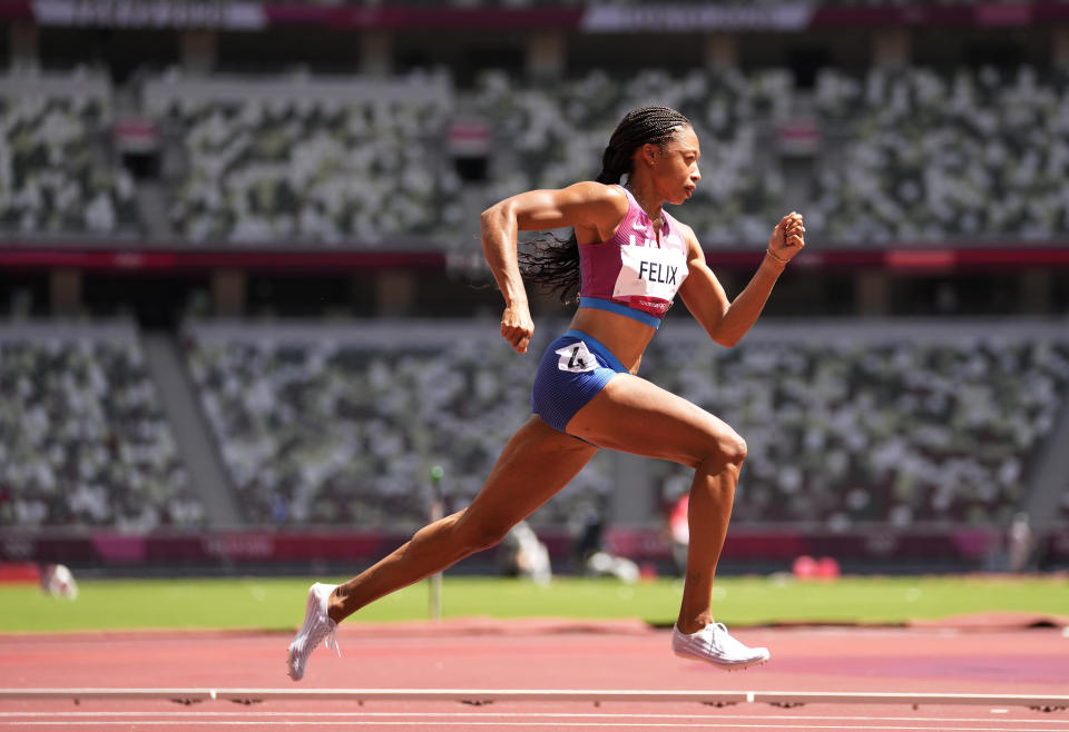 Allyson Felix, of United States races in a women's 400-meter heat at the 2020 Summer Olympics, Tuesday, Aug. 3, 2021, in Tokyo, Japan. (AP Photo/Martin Meissner)