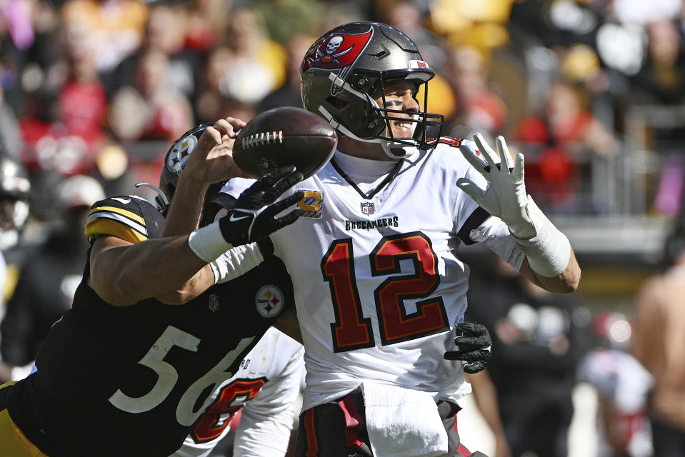Pittsburgh Steelers linebacker Alex Highsmith (56) forces a fumble as he hits Tampa Bay Buccaneers quarterback Tom Brady (12) during the first half of an NFL football game in Pittsburgh, Sunday, Oct. 16, 2022. (AP Photo/Barry Reeger)