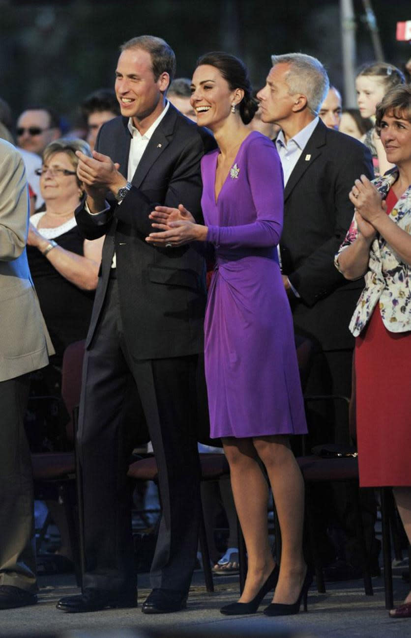 <p>Kate donned a regal purple wrap dress by Issa London for a day in Canada. She teamed the look with a silk Anya Hindmarch clutch and Prada heels. </p><p><i>[Photo: PA]</i></p>