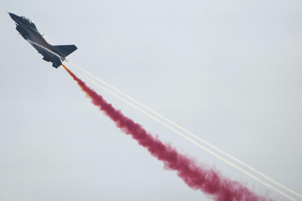 A member of the "August 1st" Aerobatic Team of the Chinese People's Liberation Army (PLA) Air Force performs during the 13th China International Aviation and Aerospace Exhibition, also known as Airshow China 2021, on Tuesday, Sept. 28, 2021 in Zhuhai in southern China's Guangdong province. (AP Photo/Ng Han Guan)