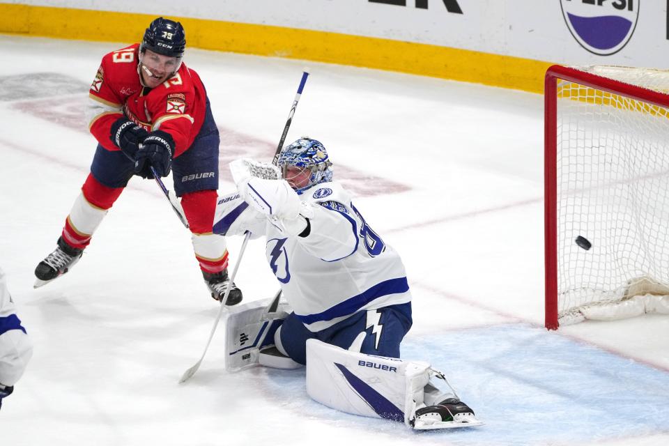 Apr 29, 2024; Sunrise, Florida, USA; Florida Panthers left wing Matthew Tkachuk (19) tips the puck wide of Tampa Bay Lightning goaltender Andrei Vasilevskiy (88) during the second period in game five of the first round of the 2024 Stanley Cup Playoffs at Amerant Bank Arena. Mandatory Credit: Jim Rassol-USA TODAY Sports