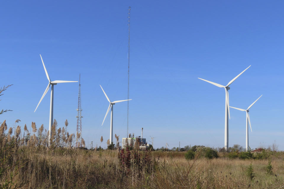 Land-based wind turbines spin in Atlantic City. N.J., on Nov. 3, 2023. On Tuesday, April 30, 2024, New Jersey utility regulators opened a fourth round of solicitations for new offshore wind farm proposals to join the three that already have preliminary approval. (AP Photo/Wayne Parry)