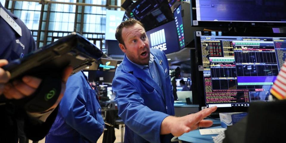 Traders work on the floor of the New York Stock Exchange (NYSE)