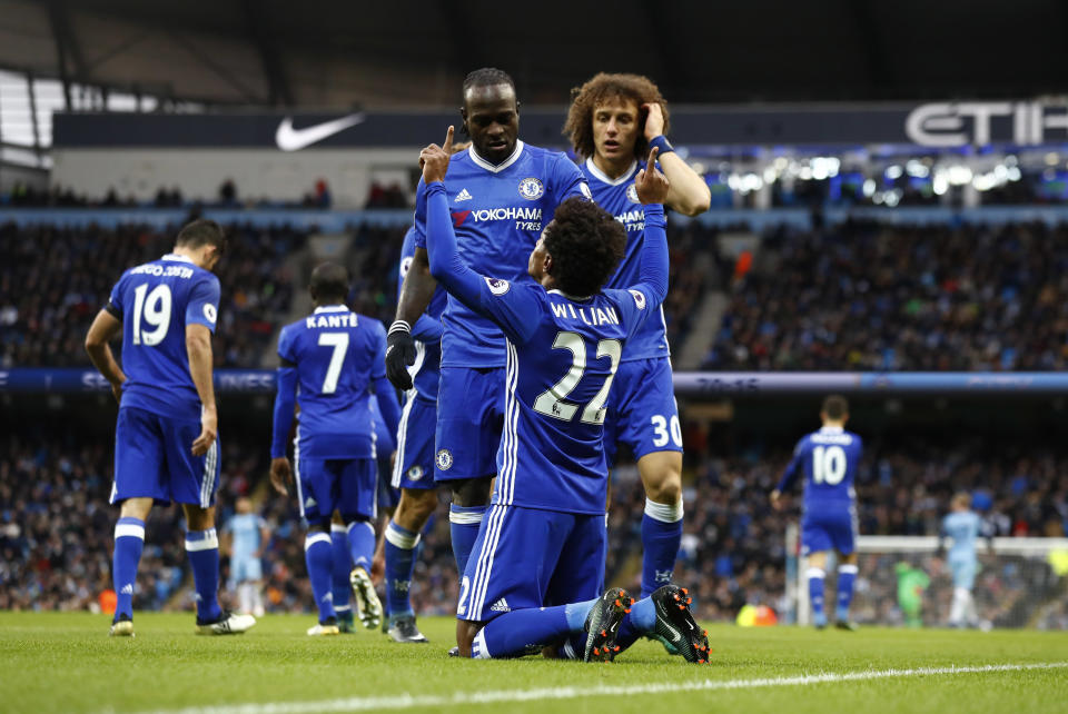 Britain Football Soccer - Manchester City v Chelsea - Premier League - Etihad Stadium - 3/12/16 Chelsea's Willian celebrates scoring their second goal with team mates Action Images via Reuters / Jason Cairnduff Livepic EDITORIAL USE ONLY. No use with unauthorized audio, video, data, fixture lists, club/league logos or "live" services. Online in-match use limited to 45 images, no video emulation. No use in betting, games or single club/league/player publications. Please contact your account representative for further details.