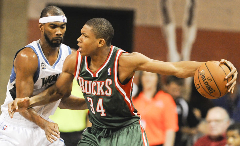 Milwaukee Bucks guard Giannis Antetokounmpo tries to get around Minnesota Timberwolves forward Corey Brewer during a preseason game in 2013. (AP Photo/Dave Weaver)