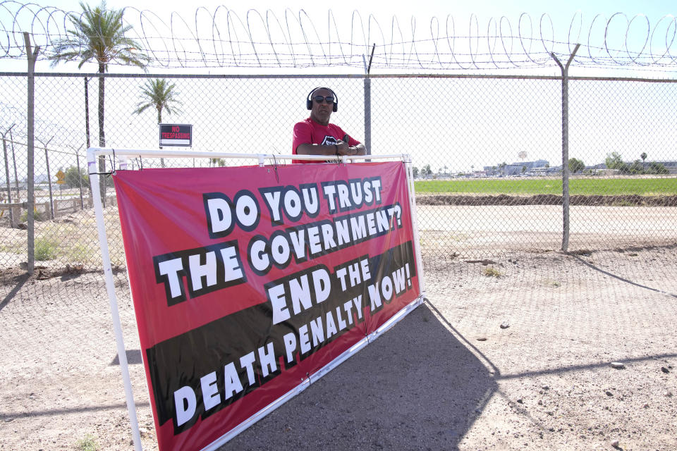 Charles Keith stands outside the state prison Wednesday, May 11, 2022 in Florence, Ariz. Inmate Clarence Dixon is scheduled to die by lethal injection Wednesday inside the state prison for his murder conviction in the killing of 21-year-old Arizona State University student Deana Bowdoin in 1978. Dixon will become the first person to be executed in the state after a nearly eight-year hiatus in its use of the death penalty. (AP Photo/Rick Scuteri)