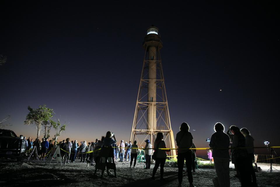 A relighting ceremony of the Sanibel Lighthouse was held on Tuesday, Feb. 28, 2023 morning. Members of the community showed up for the 6 a.m. event. The light was turned on a few minutes after six. The lighthouse has been dark since Hurricane Ian slammed into Southwest Florida. One of the legs was washed away and the cottages were destroyed in the storm. The leg is being repaired.  