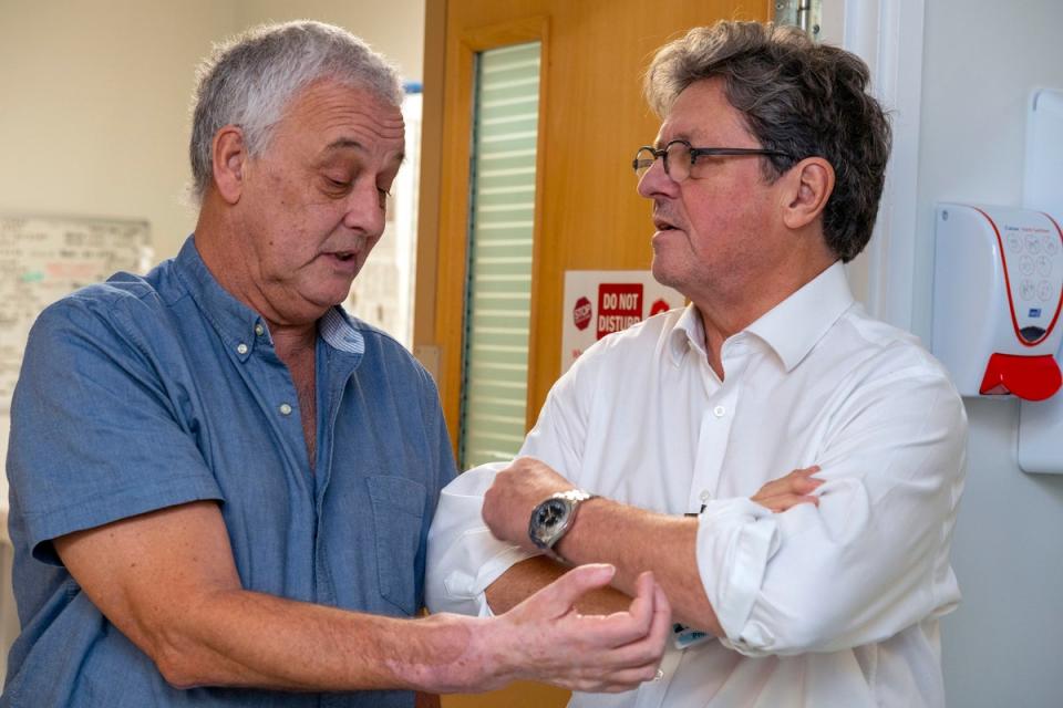 Hand transplant patient Mark Cahill with surgeon Simon Kay at Leeds General Infirmary (PA)