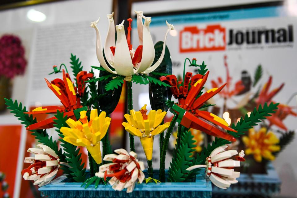 A Lego flower bouquet is seen in Amado Canlas Pinlac's Lego display at the Brick Convention at Greenville Shrine Club on Saturday, Aug. 26, 2023. Pinlac made this botanical bouquet for his wife for their 40th wedding anniversary.