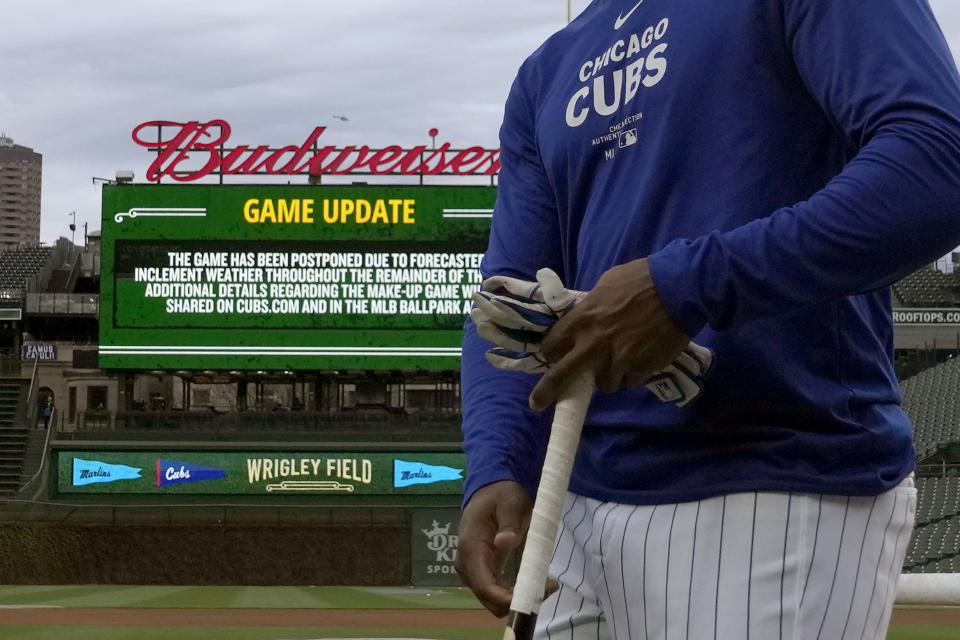 Chicago Cubs' Alexander Canario walks to the dugout after batting practice and shortly after the team's baseball game against the Miami Marlins was postponed Thursday, April 18, 2024, in Chicago. The teams are scheduled to play a split doubleheader Saturday. (AP Photo/Charles Rex Arbogast)