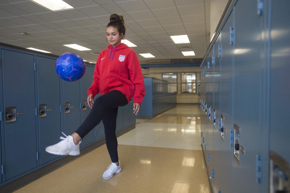Sophia Smith juggles a ball in the hallways of Fossil Ridge High School in Fort Collins, Colo., on May 3, 2018.