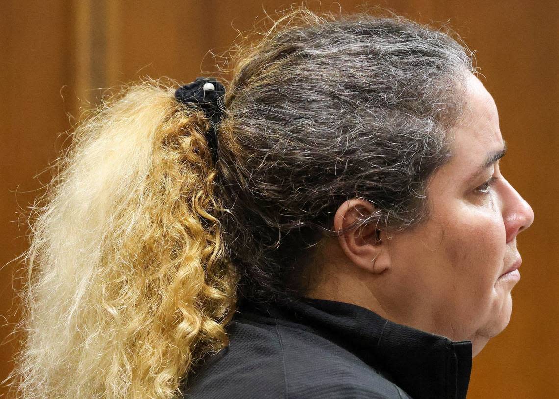 Gamaly Hollis, left, stands and listens as her team from public defender’s office makes a freedom of speech argument during her bond hearing.