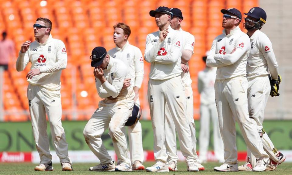 Dom Bess (left) looks up at the screen after his unsuccessful review of a not-out decision in favour of Rishabh Pant of India.