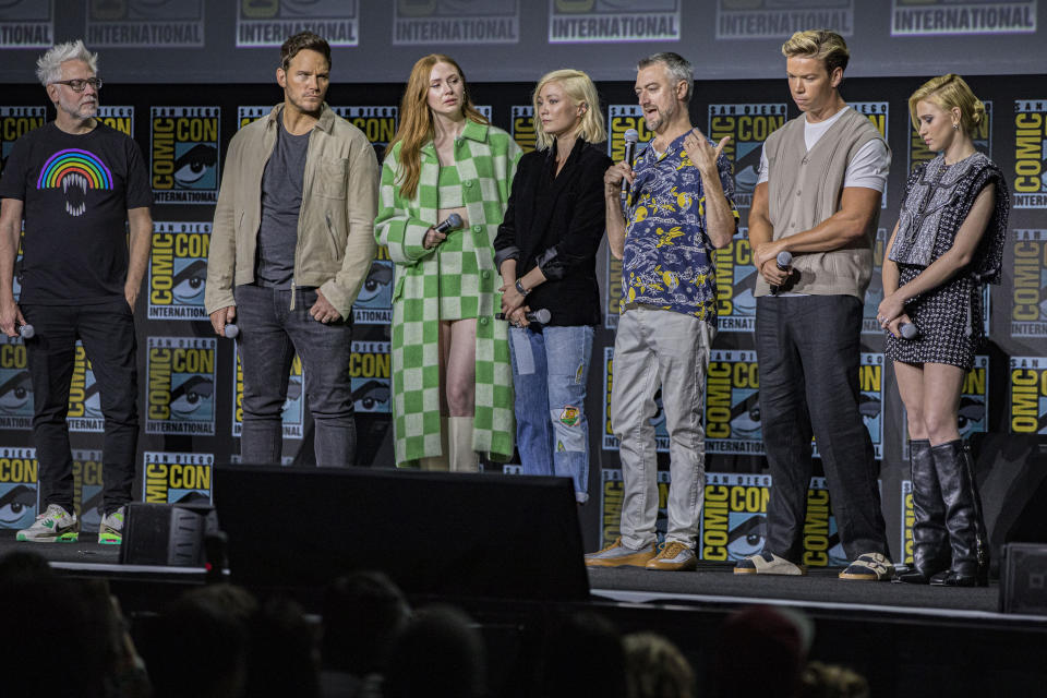 SAN DIEGO, CALIFORNIA - JULY 23: (L-R) James Gunn, Chris Pratt, Karen Gillan, Pom Klementieff, Sean Gunn, Will Poulter, and Maria Bakalova speak onstage at the Marvel Cinematic Universe Mega-Panel during 2022 Comic-Con International Day 3 at San Diego Convention Center on July 23, 2022 in San Diego, California. (Photo by Daniel Knighton/Getty Images)