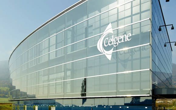 Four-story building with glass front with Celgene logo on it.