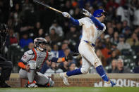 Chicago Cubs' Mike Tauchman hits a home run during the eighth inning of a baseball game against the Houston Astros, Tuesday, April 23, 2024, in Chicago. (AP Photo/Erin Hooley)