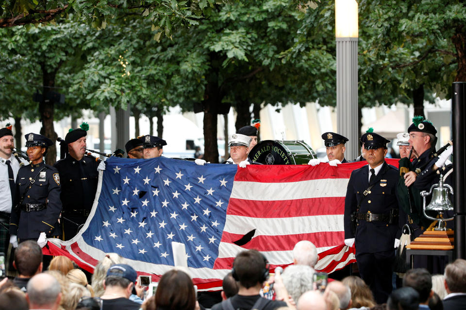 <p>A U.S. flag that few over the World Trade Center is presented during ceremonies marking the 17th anniversary of the September 11, 2001 attacks on the World Trade Center, at the National 9/11 Memorial and Museum in New York, Sept.11, 2018. (Photo: Brendan McDermid/Reuters) </p>