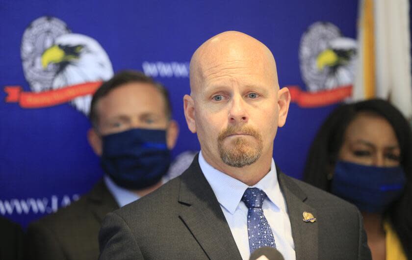 Jamie McBride, the outspoken leader of Los Angeles Police Protective League, LAPPL, the union that represents LAPD officers, comments on Los Angeles Mayor Eric Garcetti at a news conference Friday, June 5, 2020, at the LAPPL offices in Los Angeles. Mayor Garcetti is being pushed into unfamiliar roles in a city wracked by racial unrest, and his proposal to cut the police budget is seeing criticism from officers. The mayor said earlier this week city officials will identify as much as $150 million to slash from the Los Angeles Police Department budget. (AP Photo/Damian Dovarganes)