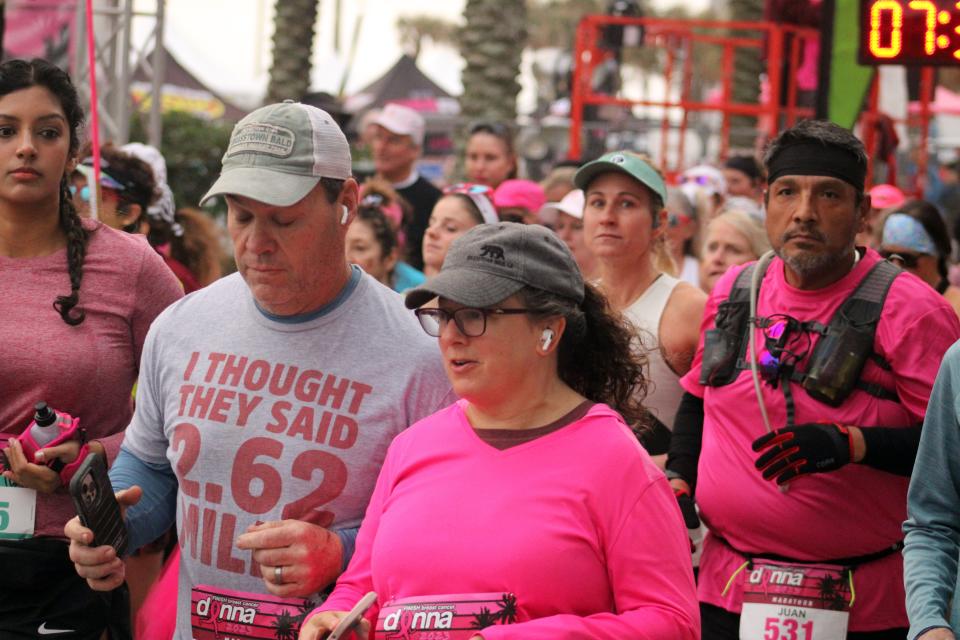 Runners break from the line at the start of the 26.2-mile  Donna Marathon in Jacksonville Beach on February 5, 2023. [Clayton Freeman/Florida Times-Union]