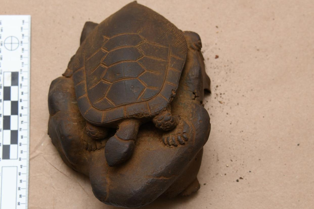 A turtle sculpture was among the 22 ancient artifacts that the FBI returned March 15 to Okinawa, Japan. A family in Massechusetts found them in their late father's attic after he passed away. The man was a WWII veteran but did not serve in the Pacific, the FBI said.