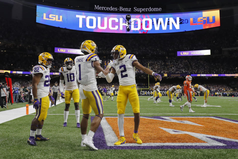LSU wide receiver Ja'Marr Chase (1) celebrates after scoring with wide receiver Justin Jefferson during the first half of a NCAA College Football Playoff national championship game against Clemson Monday, Jan. 13, 2020, in New Orleans. (AP Photo/Gerald Herbert)