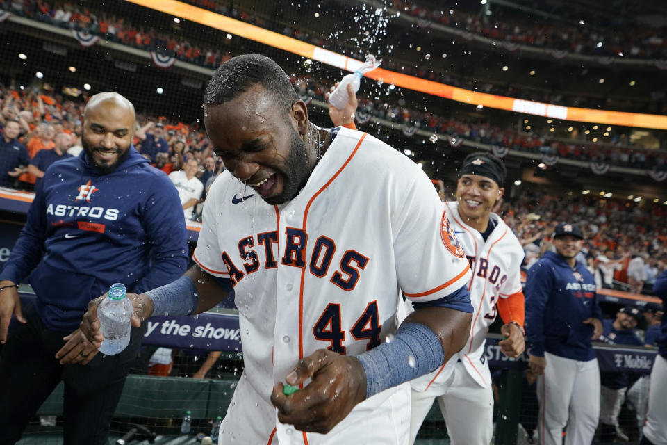 Houston Astros designated hitter Yordan Alvarez (44) celebrates with teammates after his three-run, walkoff home run against the Seattle Mariners during the ninth inning in Game 1 of an American League Division Series baseball game in Houston,Tuesday, Oct. 11, 2022. (AP Photo/David J. Phillip)