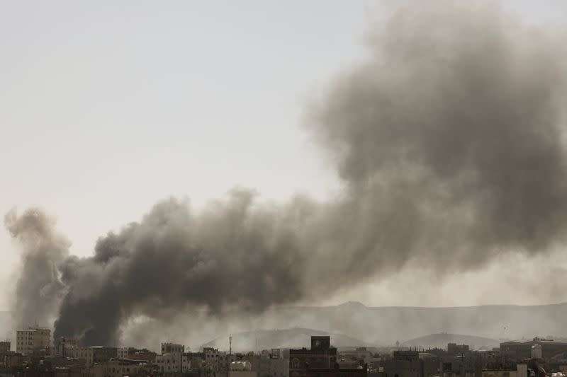 Smoke billows from the site of Saudi-led air strikes in Sanaa, Yemen