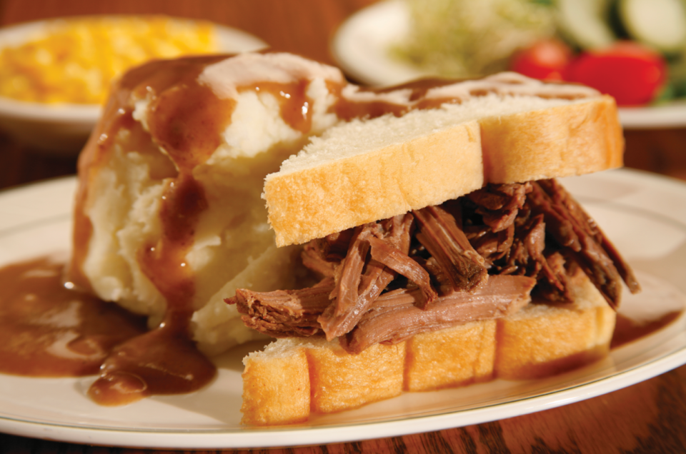 The Manhattan, served at Der Dutchman in Plain City, is a hot roast beef sandwich covered with gravy and served with mashed potatoes.