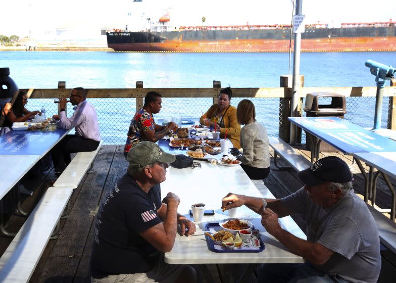 LOS ANGELES, CA-OCTOBER 8, 2019: People eat outside of the San Pedro Fish Market & Restaurant on October 8, 2019 in San Pedro, California. (Photo By Dania Maxwell / Los Angeles Times)