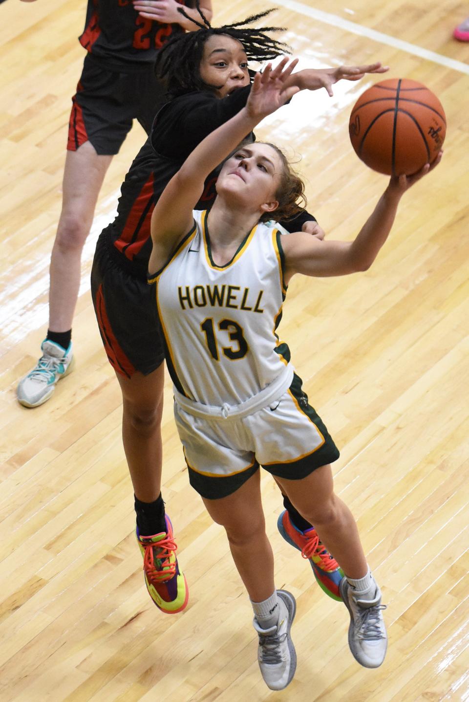 Howell's Gabby Piepho, who scored 30 points, takes a shot while defended by Maya Joiner during a 56-34 victory over Canton Wednesday, Jan. 17, 2024.