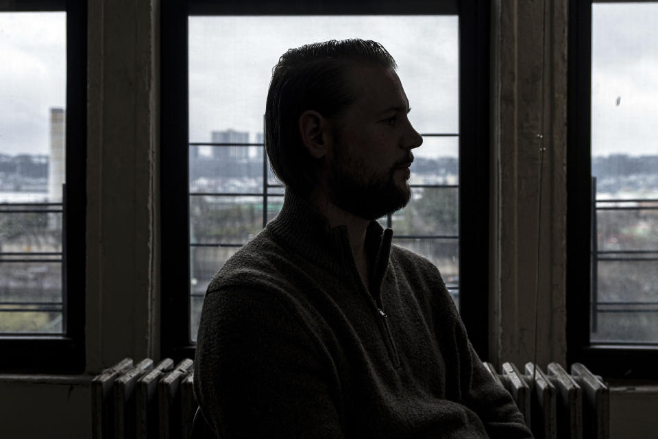 Steve Caccamo, a former student at the Academy at Ivy Ridge, poses for a photo in his apartment, Thursday, March 28, 2024, in New York. A Netflix docuseries spotlighting abuse allegations at the long-shuttered Academy at Ivy Ridge in rural northern New York has prompted dozens of new complaints to the local prosecutor and a fresh investigation. (AP Photo/Peter K. Afriyie)