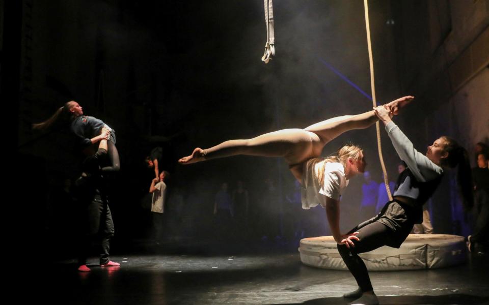 Ukrainian students from the Kyiv Municipal Academy of Performing and Circus Arts and members of Czech Cirk La Putyka contemporary circus company rehearse before a joint performance in Prague, Czech Republic, March 21, 2022.  - Stringer/Reuters