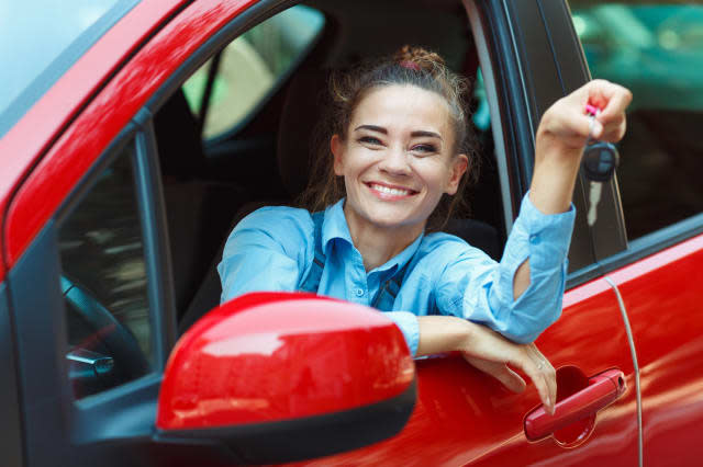 young cheerful woman sitting in ...