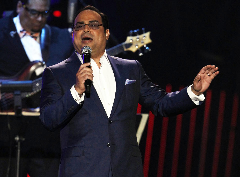 FILE - This April 26, 2012 file photo shows Gilberto Santa Rosa performing during the Latin Billboard Awards in Coral Gables, Fla. Santa Rosa will make his Broadway debut as a guest vocalist in musical "Forever Tango," which returns to the theater Mecca in July with some covers of the Puerto Rican singer’s hits. (AP Photo/Lynne Sladky, file)