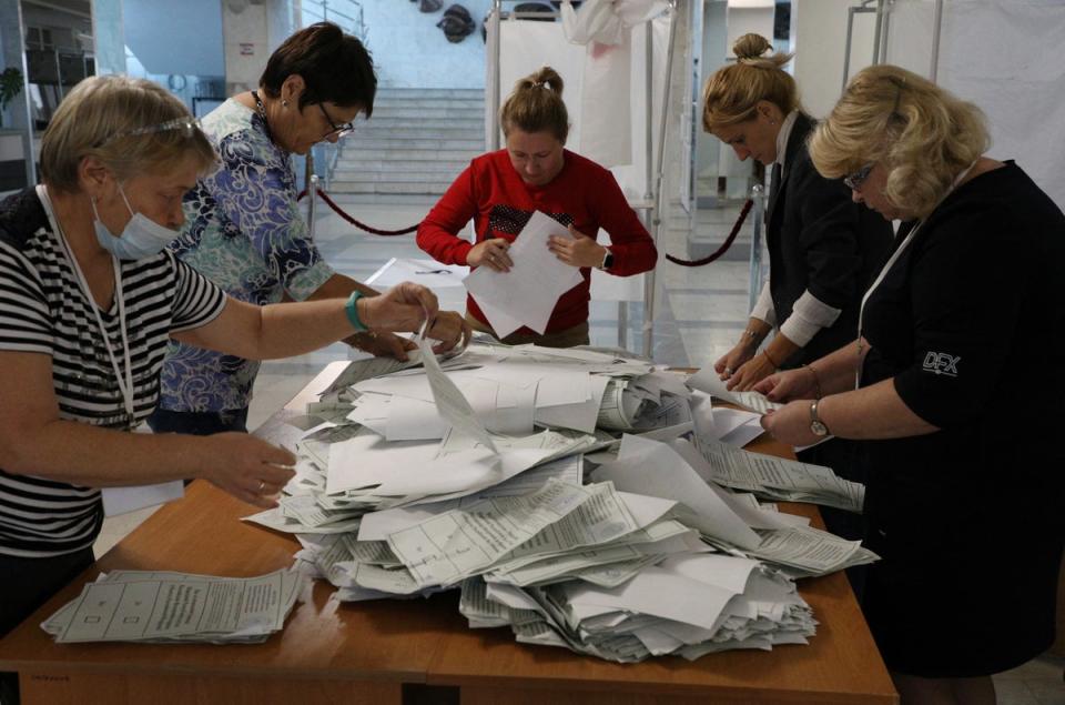 Members of a local electoral commission count ballots at a polling station in Sevastopol (Reuters)