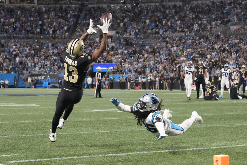 Sep 18, 2023; Charlotte, North Carolina, USA; New Orleans Saints wide receiver <a class="link " href="https://sports.yahoo.com/nfl/players/29281" data-i13n="sec:content-canvas;subsec:anchor_text;elm:context_link" data-ylk="slk:Michael Thomas;sec:content-canvas;subsec:anchor_text;elm:context_link;itc:0">Michael Thomas</a> (13) catches the ball as Carolina Panthers cornerback <a class="link " href="https://sports.yahoo.com/nfl/players/31025" data-i13n="sec:content-canvas;subsec:anchor_text;elm:context_link" data-ylk="slk:Donte Jackson;sec:content-canvas;subsec:anchor_text;elm:context_link;itc:0">Donte Jackson</a> (26) defends in the second quarter at Bank of America Stadium. Mandatory Credit: Bob Donnan-USA TODAY Sports