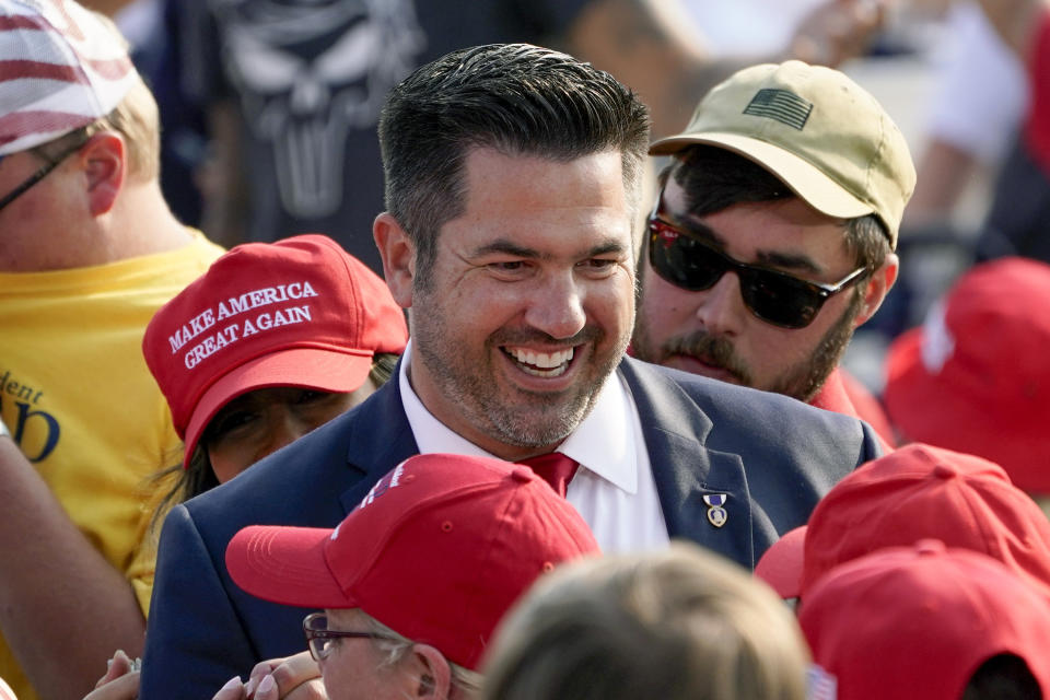 Sean Parnell walks through a crowd gathered at a campaign rally for then-President Donald Trump on Sept. 22, 2020. 