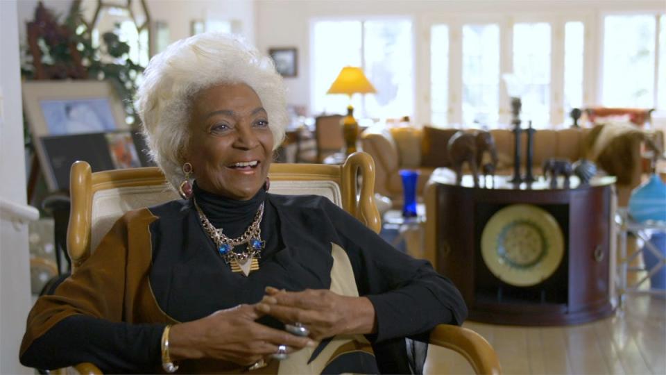 Actress Nichelle Nichols, who played Uhura on "Star Trek: The Original Series," laughs in a scene from the documentary "Woman In Motion," streaming June 3 on Paramount+.