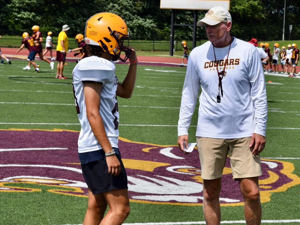 Bloomington North head football coach Scott Bless talks with junior kicker Noah Nelson during practice on Wednesday, August 3, 2022. (Seth Tow/Herald-Times)
