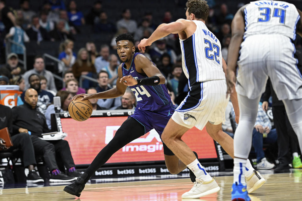 Charlotte Hornets forward Brandon Miller (24) drives against Orlando Magic forward Franz Wagner (22) during the first half of an NBA basketball game Tuesday, March 5, 2024, in Charlotte, N.C. (AP Photo/Matt Kelley)