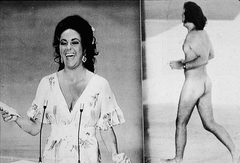 The 1974 Oscars got a little more R-rated than expected when Robert Opel, an English teacher, stripped down and sprinted onstage while host David Niven was introducing Elizabeth Taylor.After the stunt, Niven quipped, 