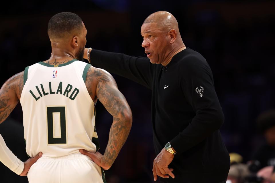 Bucks head coach Doc Rivers talks to guard Damian Lillard during a game against the Los Angeles Lakers on March 8. The two joined forces in Milwaukee as new members of the Bucks this season.