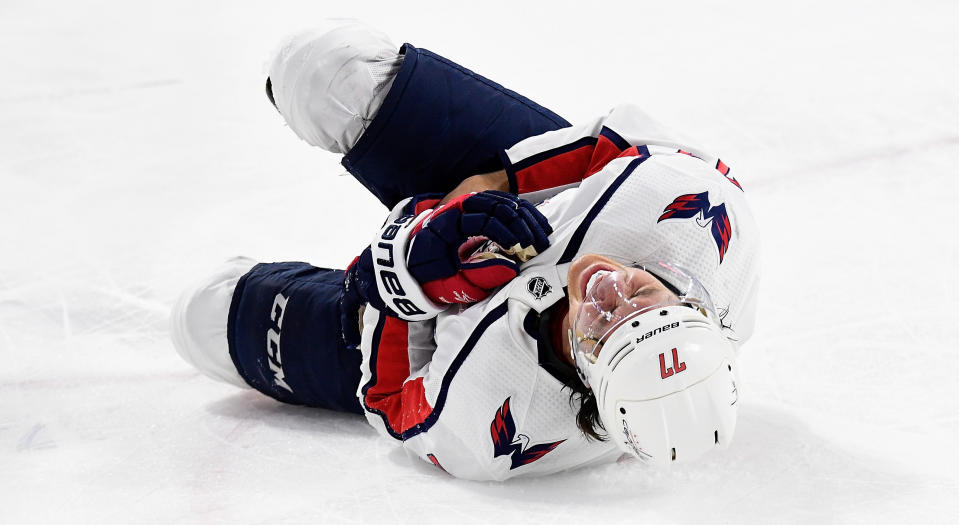 T.J. Oshie of the Washington Capitals reacts after being injured in the third period. (Photo by Grant Halverson/Getty Images)