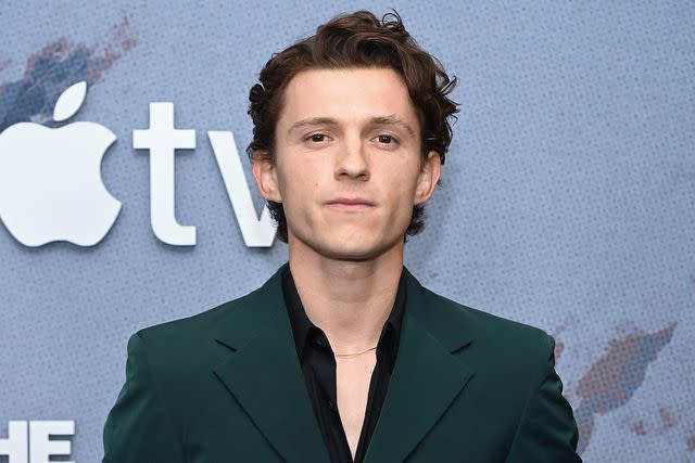 <p>Anthony Behar/Alamy</p> Tom Holland attends the premiere of "The Crowded Room" in New York City.