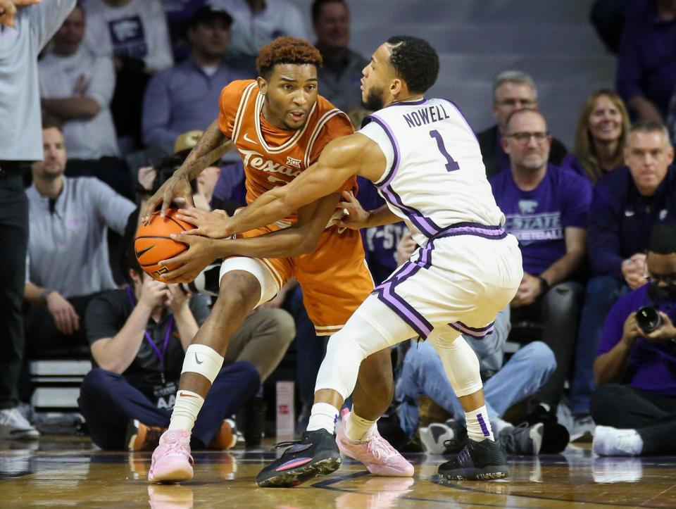 Texas Longhorns guard Arterio Morris (2) controls the ball against Kansas State Wildcats guard Markquis Nowell (1) Saturday at Bramlage Coliseum.