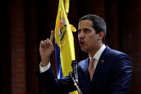 Venezuelan opposition leader Juan Guaido, who many nations have recognized as the country's rightful interim ruler, attends a meeting with political leaders at a university in Caracas, Venezuela April 1, 2019. REUTERS/Manaure Quintero