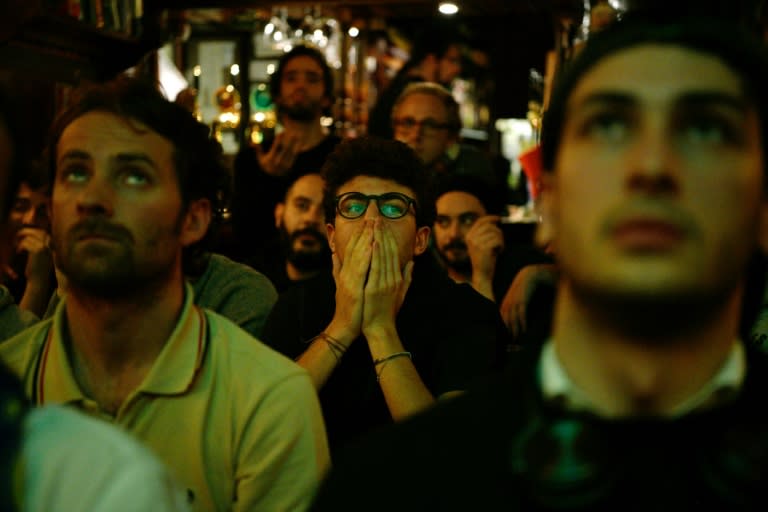 Distraught Italian supporters react at the end of the FIFA 2018 World Cup qualification 2nd leg match Italy vs Sweden, at a pub in Milan, on November 13, 2017