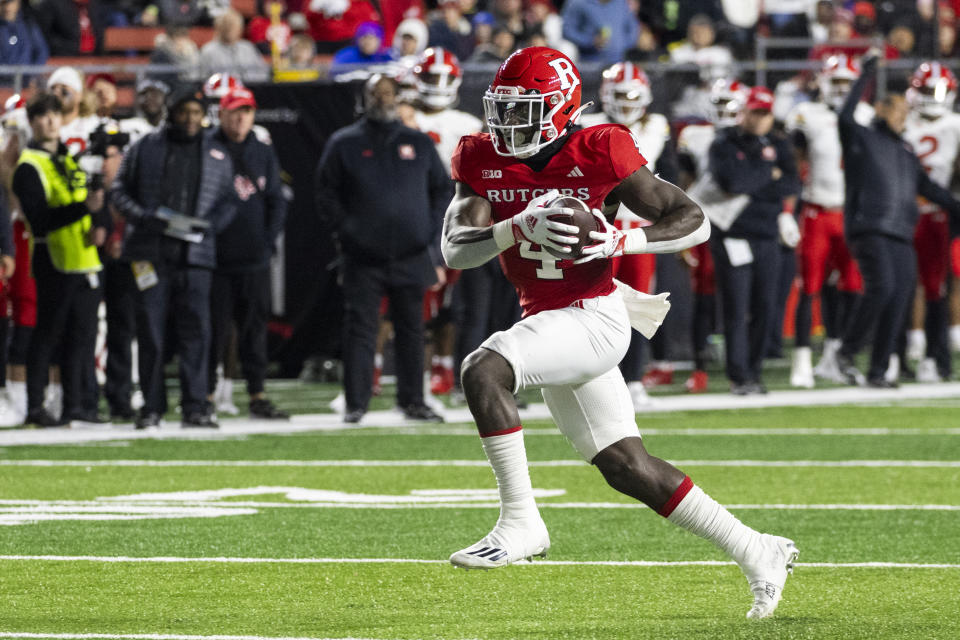 Rutgers running back Aaron Young (4) runs for a touchdown in the first half of an NCAA college football game against Maryland, Saturday, Nov. 25, 2023, in Piscataway, N.J. (AP Photo/Corey Sipkin)