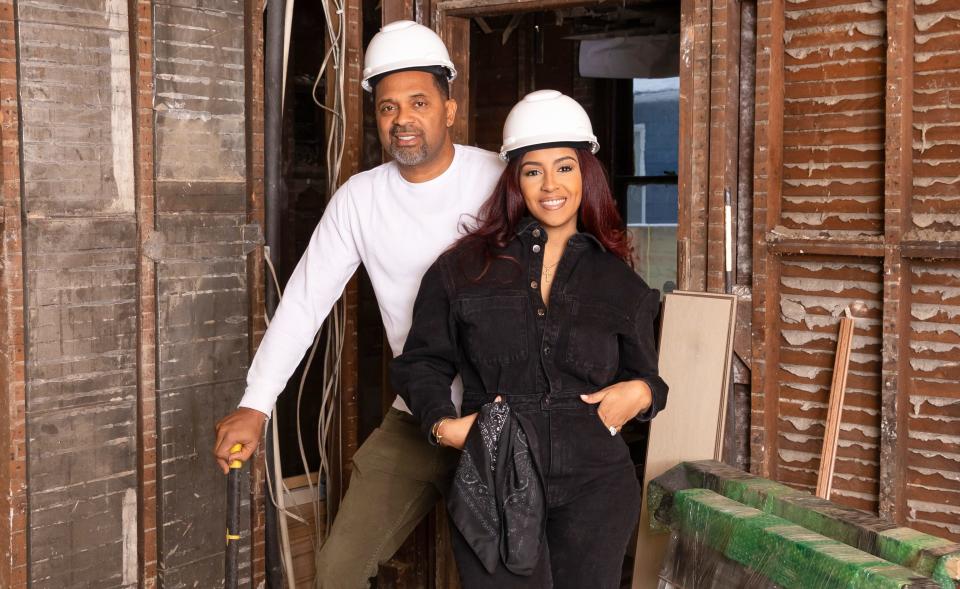 Mike and Kyra Epps of "Buying Back the Block," pose inside one of one of the homes they are renovating near 21st Street and Carrollton Avenue with hopes of revitalizing the Indianapolis neighborhood in which he grew up.